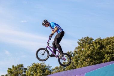 Munich, Germany - Aug 11, 2022: Riders compete at the BMX Freestyle European Championsships at Olympiapark in Munich, Germany. Men's qualifiacation