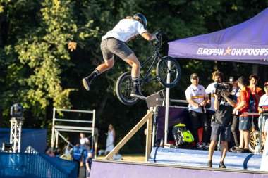 Munich, Germany - Aug 11, 2022: Riders compete at the BMX Freestyle European Championsships at Olympiapark in Munich, Germany. Men's qualifiacation