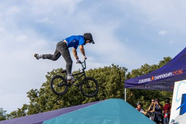 Munich, Germany - Aug 11, 2022: Riders compete at the BMX Freestyle European Championsships at Olympiapark in Munich, Germany. Men's qualifiacation