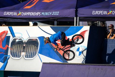 Munich, Germany - Aug 11, 2022: Riders compete at the BMX Freestyle European Championsships at Olympiapark in Munich, Germany. Men's qualifiacation
