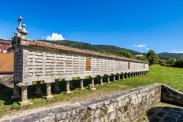 The long and narrow grain store, horreo at Carnota in Galicia, Spain. This particular horreo is claimed to be the region's largest complete and original example and it is nearly 35 metres in length.