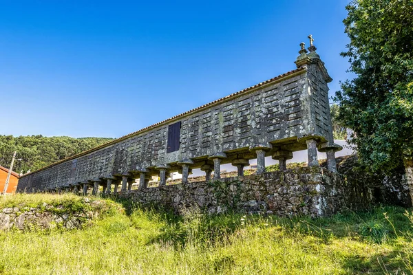 The long and narrow grain store, horreo at Lira in Galicia, Spain. This particular horreo is claimed to be one of the largest and original example and it is nearly 35 metres in length.