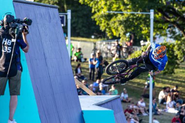 Munich, Germany - Aug 11, 2022: Riders compete at the BMX Freestyle European Championsships at Olympiapark in Munich, Germany. Men's qualifiacation
