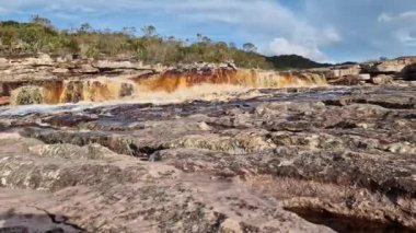 The Tiburtino waterfall in Mucuge, in the Chapada Diamantina, in Bahia, Brazil running over rocks and stones.  Sempre Viva park