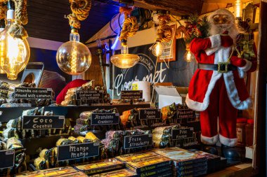 Toledo, Spain - Nov 30, 2022: illuminated Christmas market in Cathedral street, Toledo, Spain. Christmas night illumination