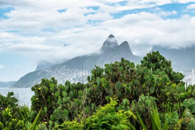 Arpoador Beach, Devil's Beach, Ipanema district of Rio de Janeiro Brazil, South America. Dos Hermanos mountains in background.