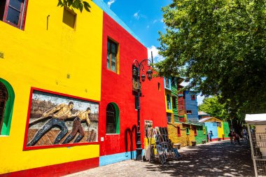 Colorful buildings in Caminito street in La Boca neighborhood at Buenos Aires, Argentina. It was a port area where Tango was born, now tourist destination with colorful houses and pedestrian stree