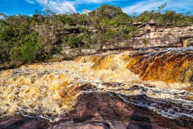 The Tiburtino waterfall in Mucuge, in the Chapada Diamantina, in Bahia, Brazil running over rocks and stones. Sempre Viva park