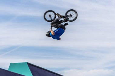 Munich, Germany - Aug 11, 2022: Riders compete at the BMX Freestyle European Championsships at Olympiapark in Munich, Germany. Men's qualifiacation