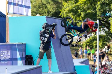 Munich, Germany - Aug 11, 2022: Riders compete at the BMX Freestyle European Championsships at Olympiapark in Munich, Germany. Men's qualifiacation