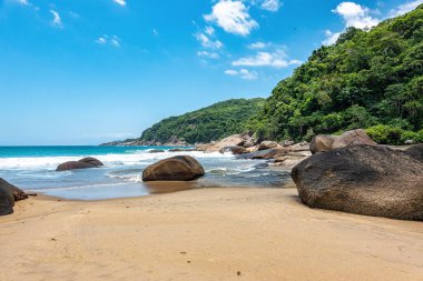 Praia de Parnaioca, Parnaioca Beach with crystal blue water and stones, deserted tropical beach on the sunny coast of Rio de Janeiro, Ilha Grande near the city of Agnra dos Reis, Brazil