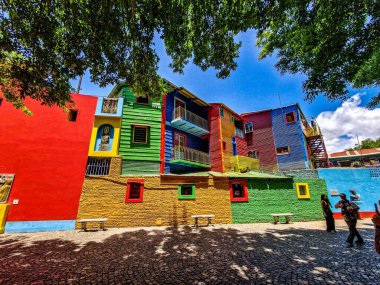 Colorful buildings in Caminito street in La Boca neighborhood at Buenos Aires, Argentina. It was a port area where Tango was born, now tourist destination with colorful houses and pedestrian stree