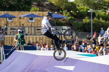 Munich, Germany - Aug 11, 2022: Riders compete at the BMX Freestyle European Championsships at Olympiapark in Munich, Germany. Men's qualifiacation