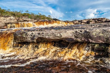 The Tiburtino waterfall in Mucuge, in the Chapada Diamantina, in Bahia, Brazil running over rocks and stones. Sempre Viva park