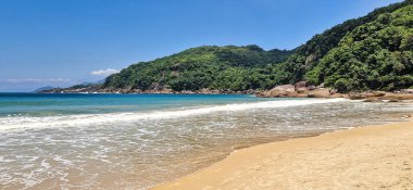 Praia de Parnaioca, Parnaioca Beach with crystal blue water and stones, deserted tropical beach on the sunny coast of Rio de Janeiro, Ilha Grande near the city of Agnra dos Reis, Brazil