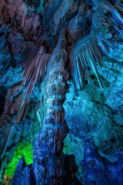 Gibraltar, United Kingdom - Nov 18, 2022: Upper Rock Nature Reserve at Gibraltar. Exploring Old St. Michaels Cave, that has been illuminated with colorful LED lighting, located at the Upper Rock Nature Reserve at Gibraltar.