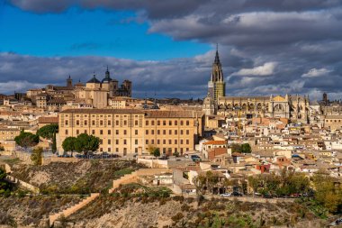Toledo, Spain - Nov 30, 2022: Old city with its Alcazar, Royal Palace over the Tagus River sinuosity. Spain, Europe