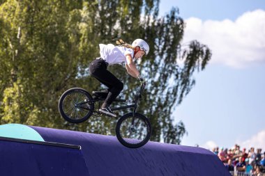 Munich, Germany - Aug 12, 2022: Riders compete at the BMX Freestyle European Championsships at Olympiapark in Munich, Germany. Men's qualifiacation