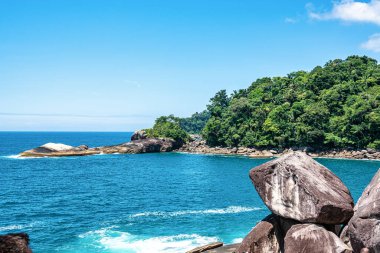 Beach Caxadaco with stones and transparent sea at island Ilha Grande, Rio de Janeiro, Brazil. Praia do Caxadaco