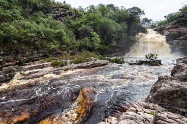 View of the river Mucugezinho with running water, forming a waterfall and Poco do Pato, in Chapada Diamantina, Bahia, Brazil