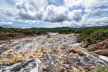Donana Waterfall in Paraguassu River with dark waters due to iron ore in Andarai, Chapada Diamantina, Bahia in Brazil