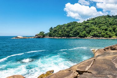 Beach Caxadaco with stones and transparent sea at island Ilha Grande, Rio de Janeiro, Brazil. Praia do Caxadaco