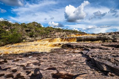 The Tiburtino waterfall in Mucuge, in the Chapada Diamantina, in Bahia, Brazil running over rocks and stones. Sempre Viva park