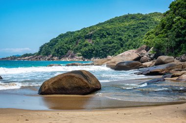 Praia de Parnaioca, Parnaioca Beach with crystal blue water and stones, deserted tropical beach on the sunny coast of Rio de Janeiro, Ilha Grande near the city of Agnra dos Reis, Brazil