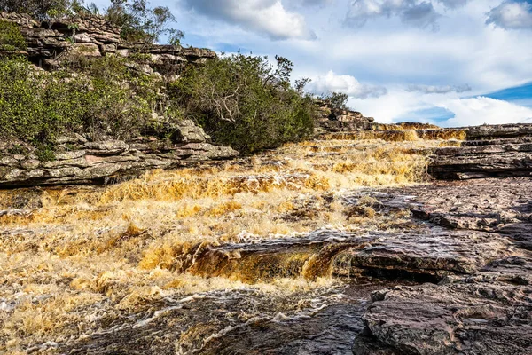 The Tiburtino waterfall in Mucuge, in the Chapada Diamantina, in Bahia, Brazil running over rocks and stones. Sempre Viva park