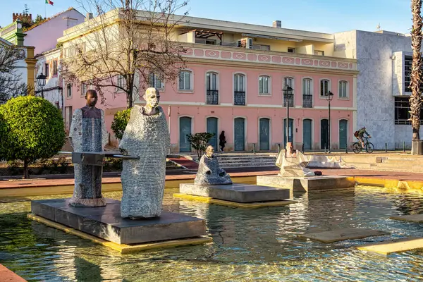 Stock image Praca Al Mutamid Square with fountains and modern sculptures at Silves, Portugal. Statues of stone male monks in an ornamental pool in Praca Al-Mutamid Park