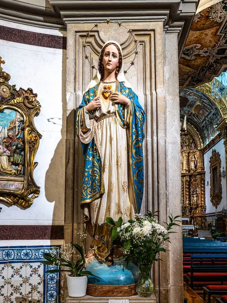 stock image Faro, Portugal - Feb 16, 2024: The intricate golden interior of the Carmelite church Igreja do Carmo at Faro in Portugal, Europe. Igreja da Ordem Terceira de Nossa Senhora do Monte do Carmo