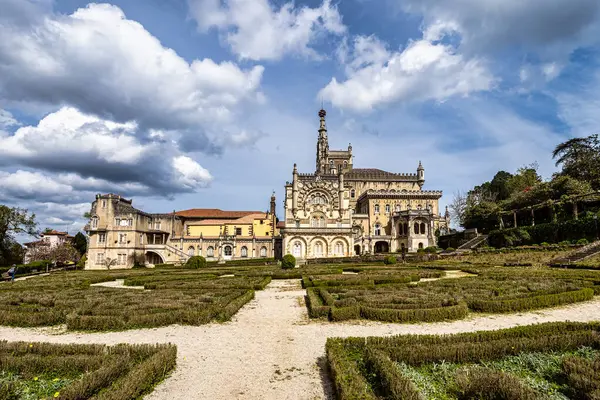 stock image Bussaco Palace Hotel, located in the Bussaco National Forest at Luso, Portugal. Built in the XIX century and now an hotel with typical Portuguese late Gothic architectural style, known as Manuelino