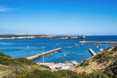 Elevated view of fisher boats moored in the Port of Sagres, Algarve in Portugal. clipart