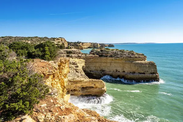 stock image Praia da Marinha Beach among rock islets and cliffs seen from Seven Hanging Valleys Trail, Percurso dos Sete Vales Suspensos. Algarve, Portugal