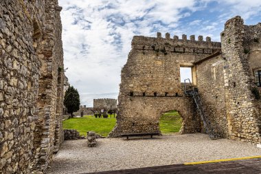 The imposing castle of the village of Montemor-o-Velho in Portugal is the main fortress of the Baixo Mondego in medieval times clipart