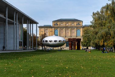 Munich, Germany - Oct 14, 2024: UFO in front of the Pinakothek der Moderne, Munich, Bavaria, Germany, Europe clipart