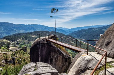 View from Fafiao viewpoint located on the top of parish of Cabril in Montalegre municipality, overlooking Geres Valley, Salamonde Dam and river, Portugal clipart