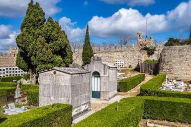 Castle and Igreja Matriz cemetery in Santiago do Cacem, Alentejo in Portugal clipart