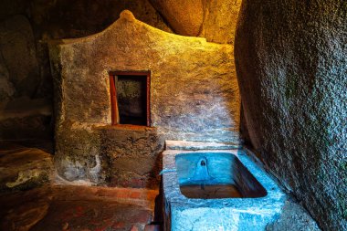 Abandoned and empty medieval Convento dos Capuchos in the Serra de Sintra National Park in Portugal clipart