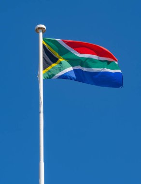 South Africa flag against blue sky in Cape Town South Africa