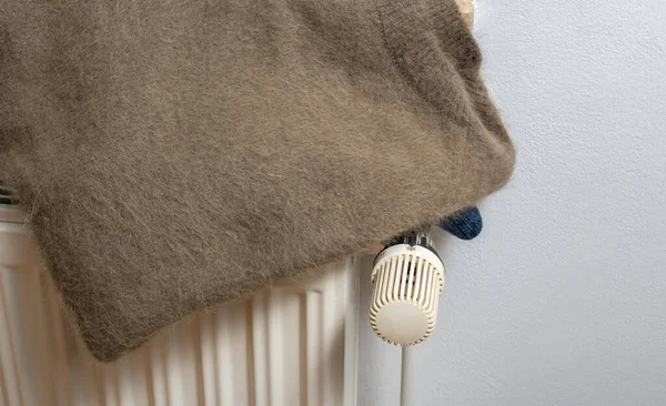 Angora sweater on a heater for the cold winter season