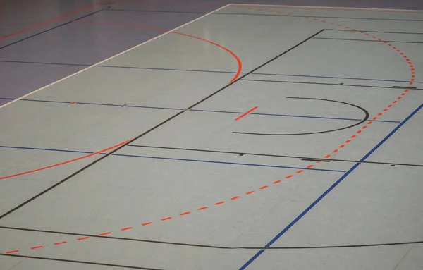 Hall floor in a sports hall with various playing field lines