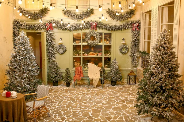 A festively decorated room under a French cafe for Christmas. Interiors New Year\'s concept