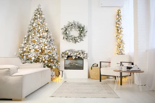 New Year\'s interior design. Bright room with a Christmas tree decorated with balls and lights, a sofa, a fireplace and an armchair. Home design concept