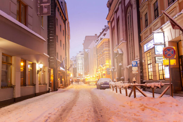 Illuminated street in the city. Christmas decorations in the old town Riga, Latvia.