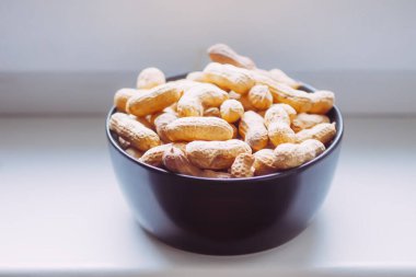 Unpeeled nuts close up. Peanuts.