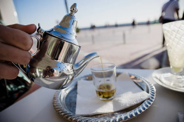 stock image Traditional Moroccan tea pot with a cup outside ready to drink