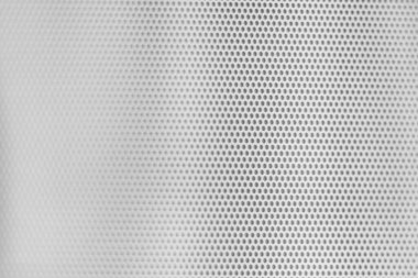 Beyaz metalik ızgara dokusu, mikrodalga pencere kapısından küçük dairesel delikler, bozulmuş nokta odaklı. 