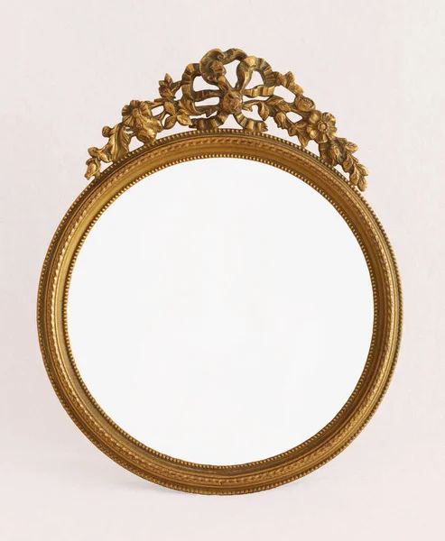Circular cast bronze frame with art Nouveau top ornament