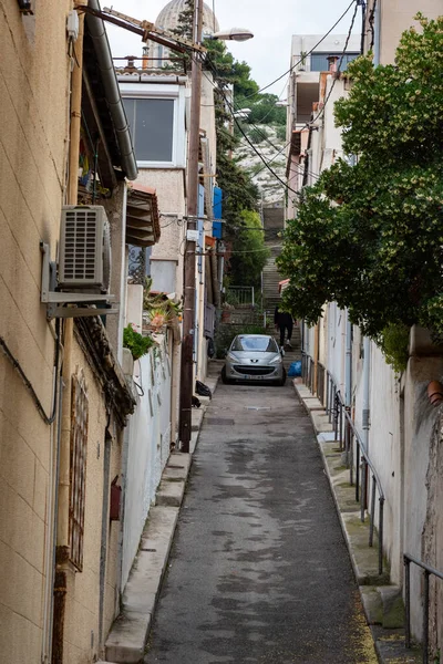 Stock image MARSEILLE, FRANCE - NOV 13, 2021 - Old Peugeot parked in the end of a narrow street